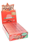 Juicy Jay’s Strawberry 1¼ flavored rolling papers display box, vivid red packaging with open display of booklets.