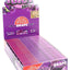 Juicy Jay’s Grape 1¼ flavored rolling papers display box, purple case with open tray showing rows of booklets.