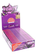 Juicy Jay’s Grape 1¼ flavored rolling papers display box, purple case with open tray showing rows of booklets.