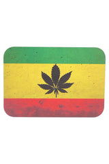 Small metal rolling tray with magnetic lid, rasta flag background with black leaf silhouette; rounded rectangle, 7″ × 5″.
