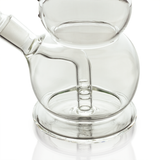 Close-up of Hemper snowman bong base with clear round chamber and multi-slit fission diffuser perc.