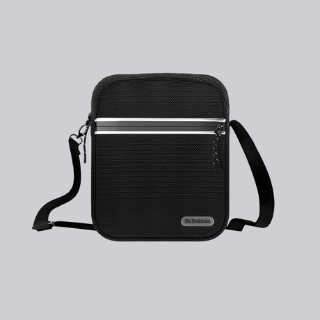 Dr. Dabber Tour Bag in black ballistic nylon with logo badge, zipper trim, and wide carry strap