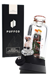 Angled Puffco Peak setup with Renew the Redwood glass, clear chamber, tree trunk, and owl cap
