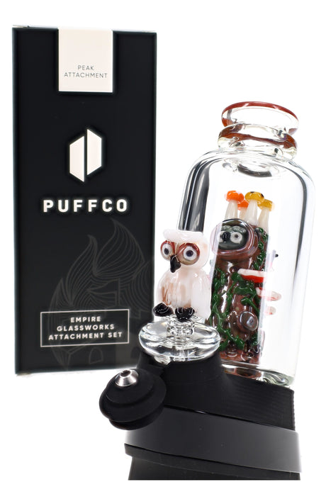 Angled Puffco Peak setup with Renew the Redwood glass, clear chamber, tree trunk, and owl cap