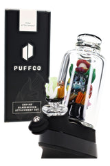 Puffco Peak setup with ocean-themed glass attachment, coral reef carb cap, and clear curved mouthpiece