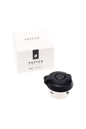 Puffco Proxy 3D Chamber next to retail box, compact replacement atomizer with black silicone top and stainless housing.