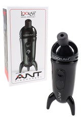 Black Lookah ANT wax pen beside packaging, compact metal body with USB-C charging and magnetic cap highlighted.