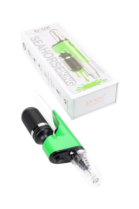 Green Lookah Seahorse King electric dab straw shown next to box, metal body, glass mouthpiece, magnetic tip cover.