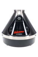 Volcano Hybrid vaporizer in stainless finish, straight-on view highlighting the sleek cone body and illuminated touchscreen.