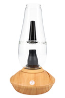 Zenco Flow desktop vaporizer in wood finish with clear water glass, black mouthpiece, and auto-fill cup design centered on the base.