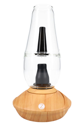 Zenco Flow desktop vaporizer in wood finish with clear water glass, black mouthpiece, and auto-fill cup design centered on the base.