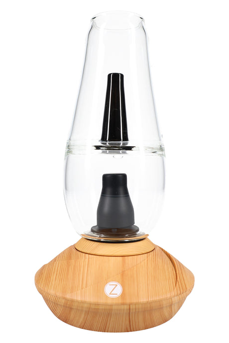 Zenco Flow desktop vaporizer in wood finish with clear water glass, black mouthpiece, and auto-fill cup design centered on the base.