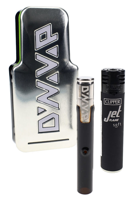 DynaVap G3 glass vaporizer standing beside branded metal carry tin and torch lighter for size reference.
