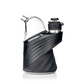Puffco Peak base with MJ Arsenal Bridge glass top installed, side profile highlighting the curved outlet for hose connection.