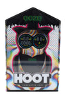 Ooze Hoot character vape in Glitch rainbow color, packaged in a window box with dual circular screens visible for voltage and puffs.