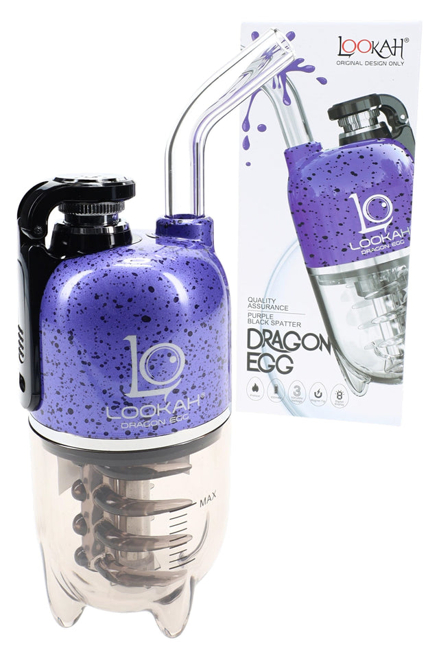 Lookah Dragon Egg electric dab rig in purple with black splatter, curved glass mouthpiece and water cup next to retail box.
