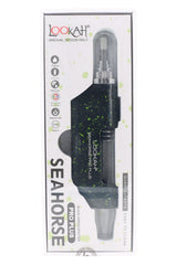 Black and green Splatter Seahorse Pro Plus dab pen boxed for retail, compact body with visible glass chamber and tip.