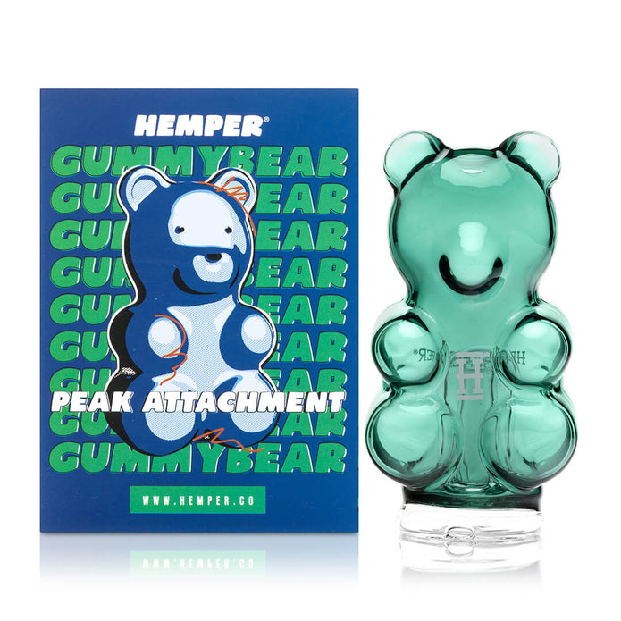 Boxed Hemper gummy bear Peak top beside glass piece on white background, gift-ready device glass upgrade