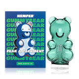 Boxed Hemper gummy bear Peak top beside glass piece on white background, gift-ready device glass upgrade