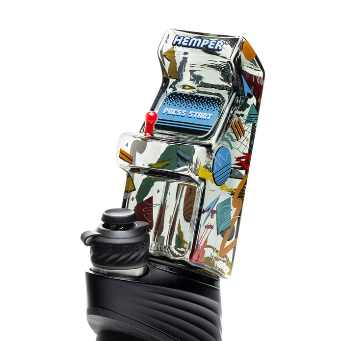 Arcade Puffco Peak glass top installed on device, angled view showing joystick detail and tall mouthpiece profile