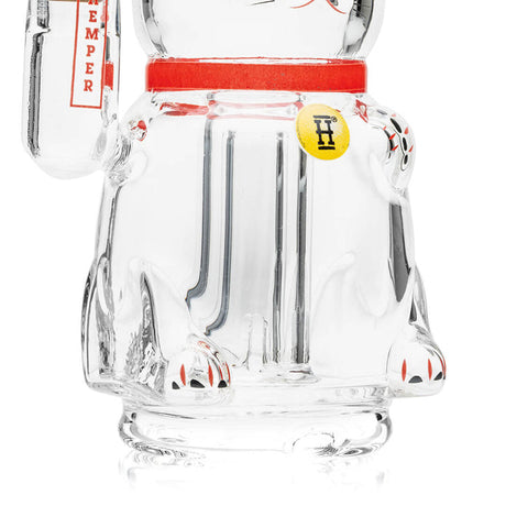 Close-up of Lucky Money Cat base and inner glass detail, red collar band and clear body connection point visible