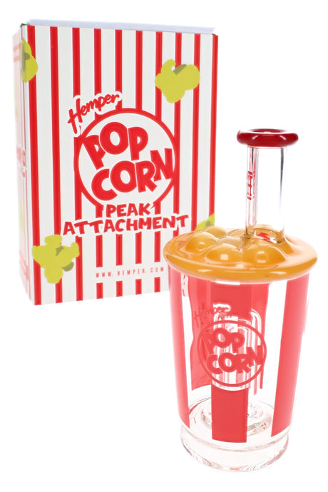 Hemper Popcorn Peak attachment beside retail box, clear glass bucket with red decals and yellow popcorn cap displayed