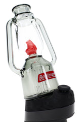 Angled lantern-style Peak attachment on device, smoke-colored base with clear chamber and red flame guard detail
