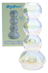 Iridescent Puffco Peak top in retail box with bubble-stack glass body and compact replacement-top shape