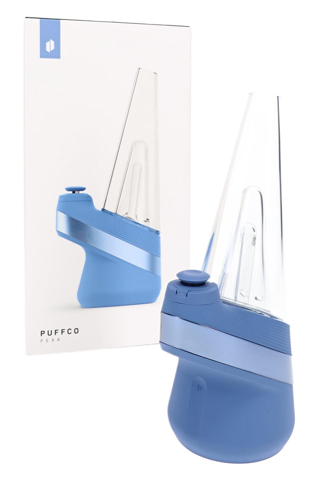 Puffco Peak Sapphire smart e-rig angled left with blue base and clear glass attachment