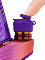 Close-up of a finger tilting the purple Joystick Cap on the Puffco Peak Pro Plasma 3DXL Chamber