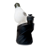White BigFun! Lightbowlb Peak Top mounted on a black Puffco device, showing its bulb shape and gray mouthpiece