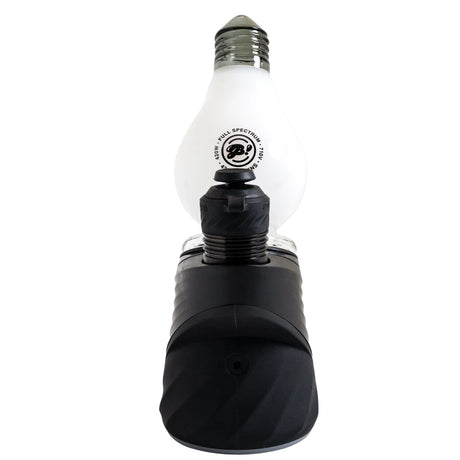 Chamber-side view of a black Puffco device with the white BigFun! Lightbowlb Peak Top behind the chamber