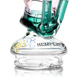 Close-up of the HEMPER Snail Dry Top showing green eyestalks, branding, and colorful flower-shaped graphics