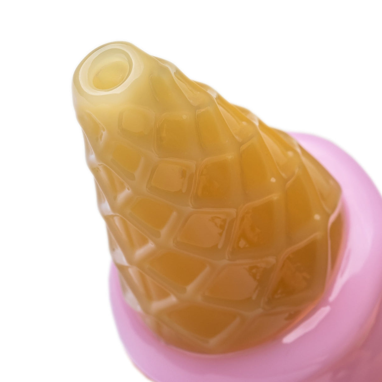 Close-up of yellow waffle cone mouthpiece on pink ice cream Pivot top with raised diamond texture