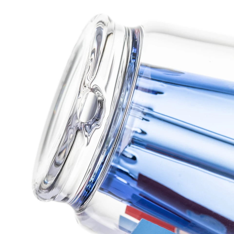 Close-up of BigFun! Sip-N-Dip Peak glass top base opening beside the blue inner chamber and thick clear glass