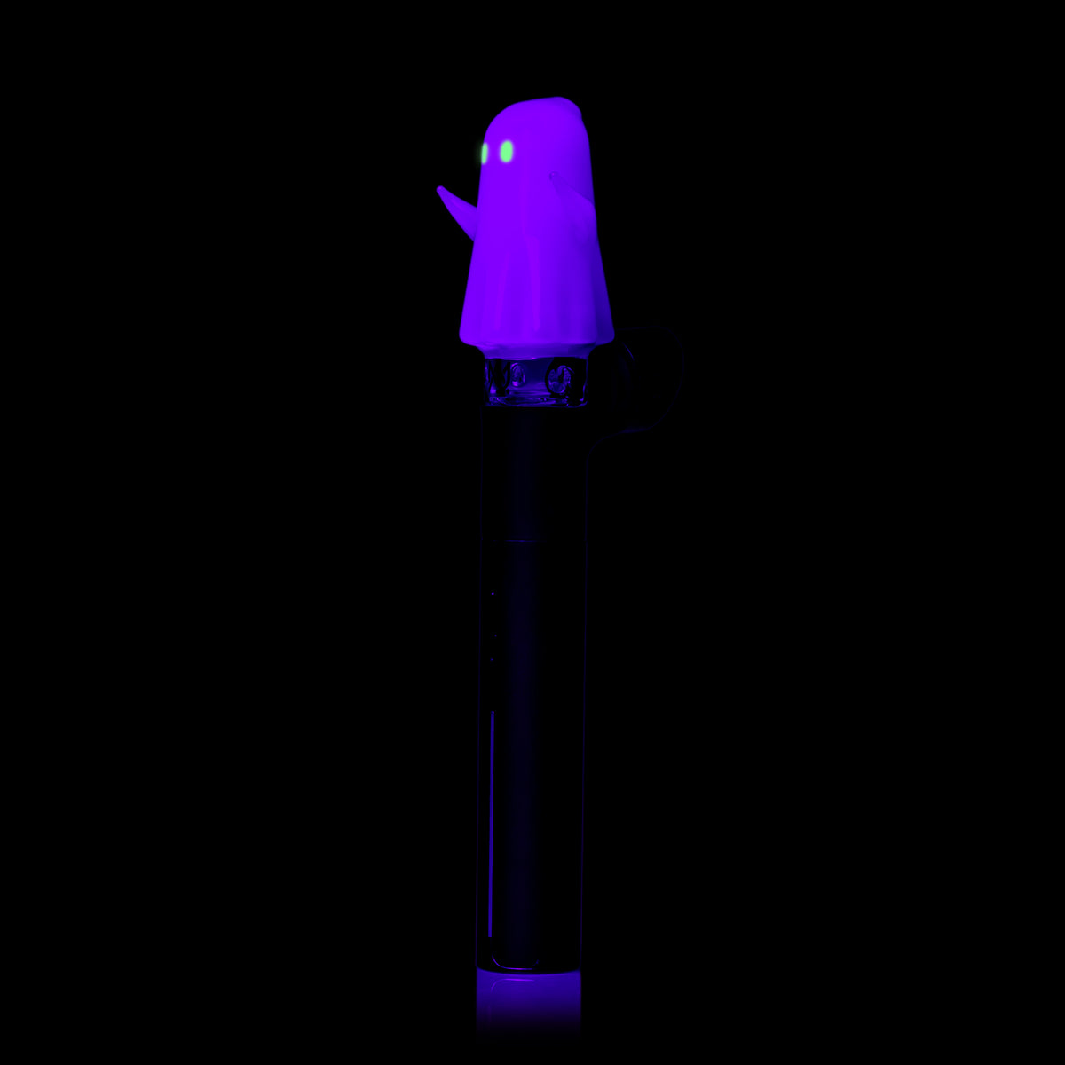 Angled UV view of MJ Arsenal Specter Pivot glass attachment with purple glow and luminous green eyes