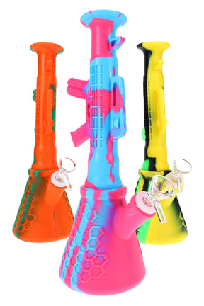 11″ heavy-duty silicone AK-47 beaker bong with honeycomb base and 14.5 mm glass bowl; three bright colorways shown, sold individually.