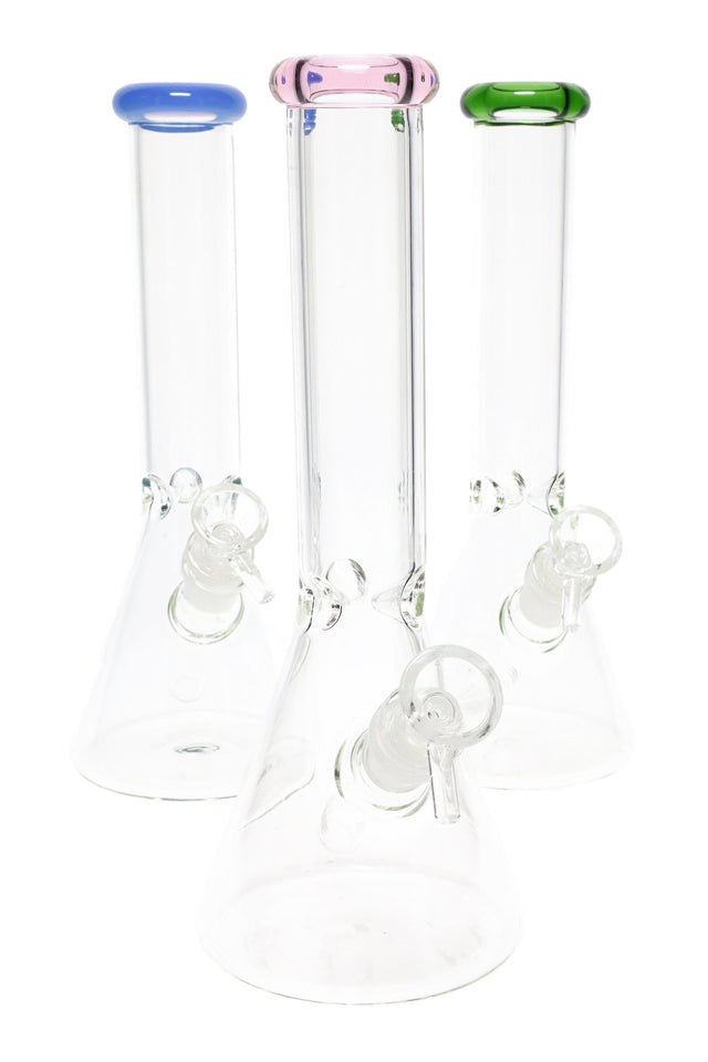 Small 10-inch clear glass beaker bong trio with colored rims in blue, pink, and green, each with GoG joint and slide on white background