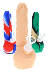 Silicone novelty bong with glass bowl shown in solid tan, red-white-blue, and green-black-tan designs