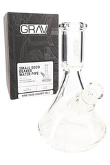GRAV Small Deco beaker bong shown beside retail box, clear borosilicate design with included 10 mm cup bowl and diffuser downstem.