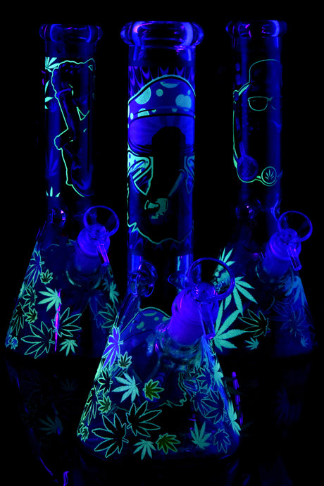 Trio of 10″ glass beaker bongs with glow-in-the-dark alien and leaf decals, ice pinch and GoG joints, assorted designs.