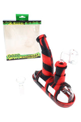 Ooze Steamboat silicone and glass bubbler dab rig with 14 mm banger, black-red body, submarine-style base beside retail box.