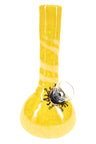 Yellow glazed ceramic bong with rounded base, tall neck, black sun decal and clear slide bowl.