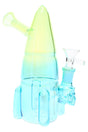 Green-blue gradient rocket ship glass bong with glass herb bowl and skull-accent joint, compact 7½″ design for smooth, space-saving sessions.