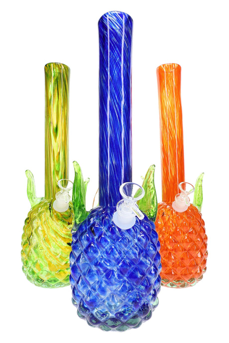 Soft glass pineapple bong with green leaf accents and blue, yellow, and orange swirled necks; tropical textured base; assorted colors, sold individually.