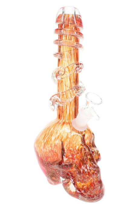 Orange soft glass skull bong showing detailed skull base and multiple spiral grip rings along the neck for secure handling.