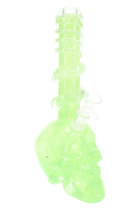 Neon-tinted green soft glass skull pipe with stacked spiral rings and a pronounced skull body; assorted colorway.