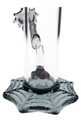 Close view inside bong showing sculpted spider figure at the end of the angled inlet over the webbed base for spooky detail.