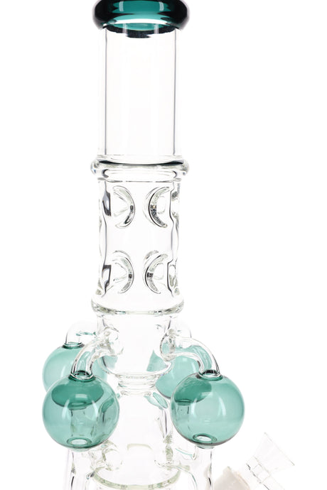 Detail of patterned neck and teal orb arms on tall glass recycler bong with GoG joint and blue mouthpiece ring.