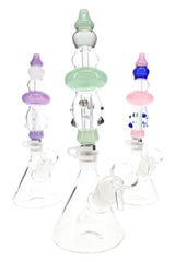Three assembled Duo Namics kits in assorted pastel colors, each with clear beaker base and matching colored body section.